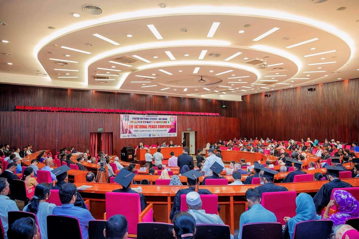 A full view of the conference hall at BMICH, Colombo — delegates and graduands seated before the stage