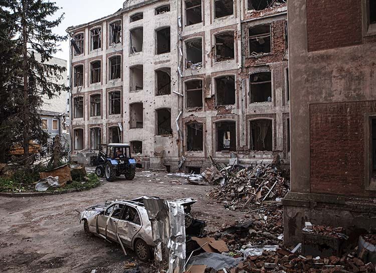 A destroyed car in the courtyard of the economics department