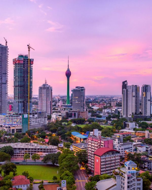 The Colombo skyline at dusk, with the Lotus Tower rising above the city
